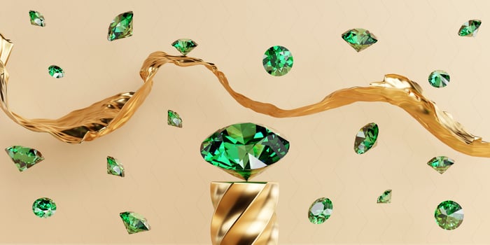 Green diamond gems falling on golden background 3d rendering photo
