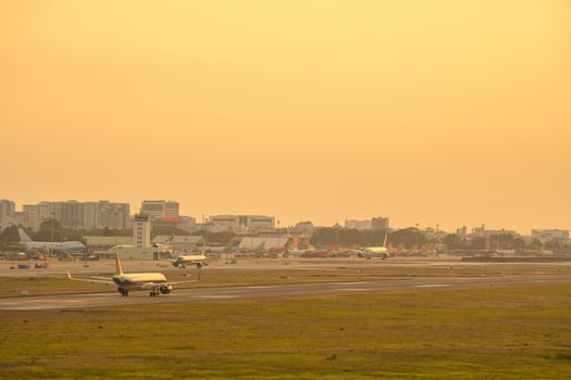 Ho Chi Minh city, Vietnam - FEB 20 2022 Airplane fly over urban areas preparing landing into Tan Son Nhat International Airport and takes off in TSN airport photo