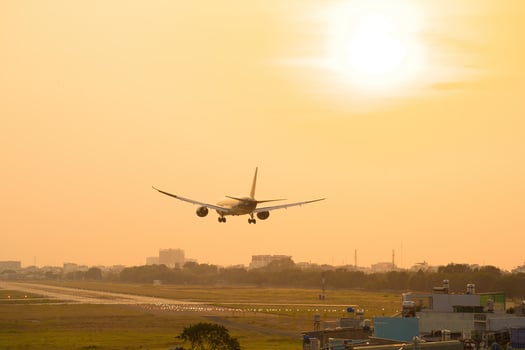 Ho Chi Minh city, Vietnam - FEB 20 2022 Airplane fly over urban areas preparing landing into Tan Son Nhat International Airport and takes off in TSN airport photo