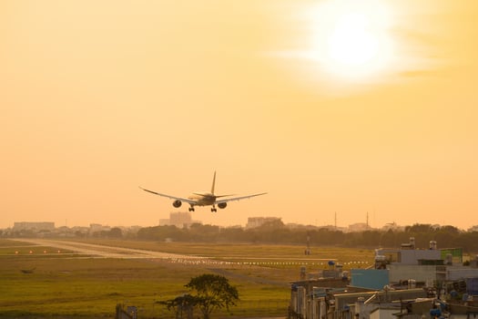 Ho Chi Minh city, Vietnam - FEB 20 2022 Airplane fly over urban areas preparing landing into Tan Son Nhat International Airport and takes off in TSN airport photo