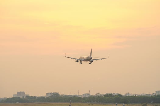 Ho Chi Minh city, Vietnam - FEB 20 2022 Airplane fly over urban areas preparing landing into Tan Son Nhat International Airport and takes off in TSN airport photo