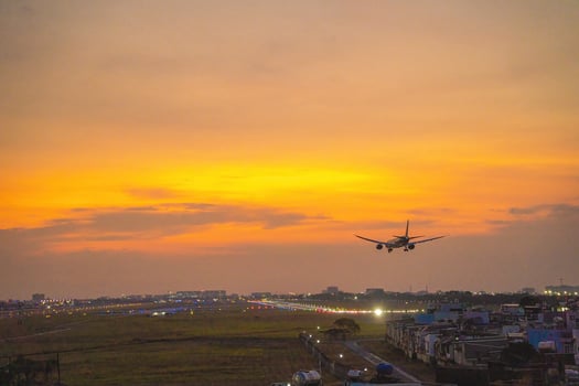 Ho Chi Minh city, Vietnam - FEB 20 2022 Airplane fly over urban areas preparing landing into Tan Son Nhat International Airport and takes off in TSN airport photo