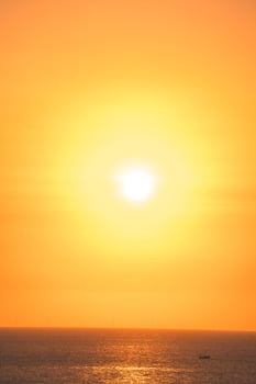 Beautiful sunset beach landscape, exotic tropical island nature, colorful red yellow sky, silhouette ship, golden sun glow reflection, summer holidays vacation. Sky cloud cinematic. photo