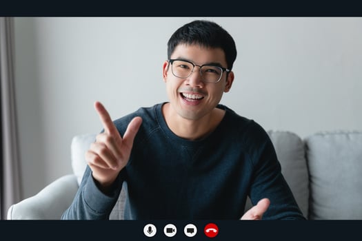 Portrait happy man working at home by video conference meeting talking and looking at camera. greeting family or friends photo