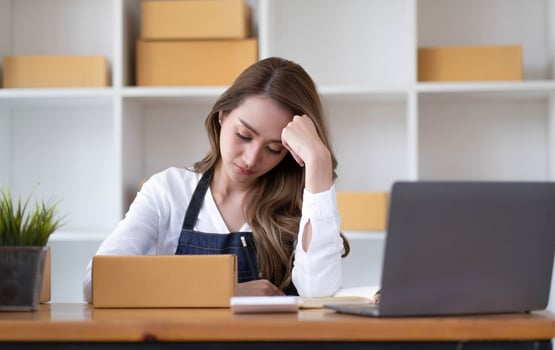 asia female  thoughtful serious doubtful feeling stress worry with financial problem in SME crisis small business challenges impact from covid coronavirus at home office. photo