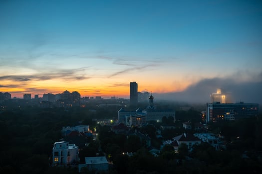 View of residential buildings at the sunset with cloudy sky. photo