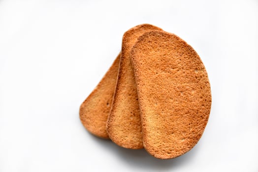 Sweet crackers for tea on a white background photo
