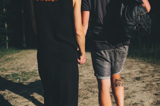 beautiful couple standing in a forest photo