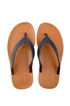 Brown rubber flip flops on a white background photo
