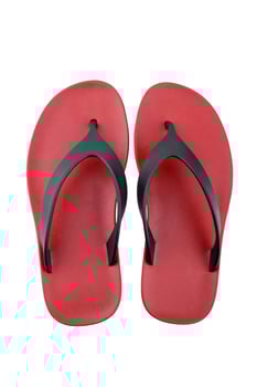 red rubber flip flops on a white background photo