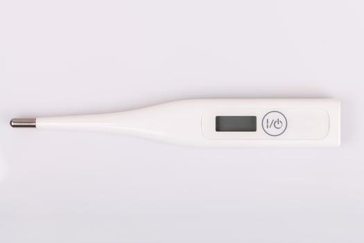 Thermometer on white background photo