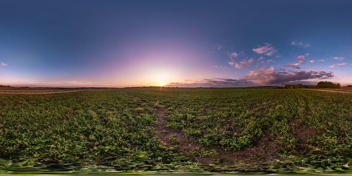 full seamless spherical hdri panorama 360 degrees angle view among fields in summer evening sunset with awesome clouds in equirectangular projection, ready for VR AR virtual reality photo