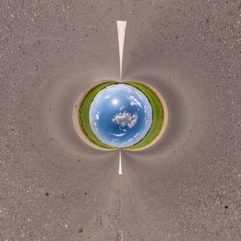 Blue little planet ball. Inversion of tiny planet transformation of spherical panorama 360 degrees. Spherical abstract aerial view. Curvature of space. photo