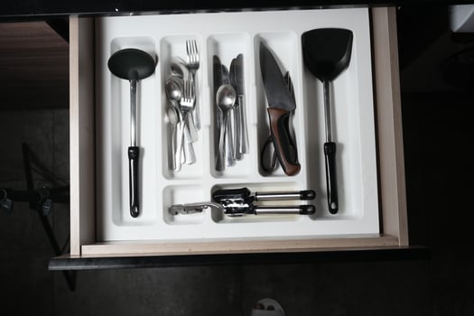 cutlery fork with knife and spoon in a drawer photo