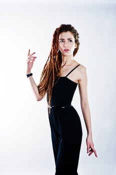 Studio shoot of girl in black with dreads on white background. photo