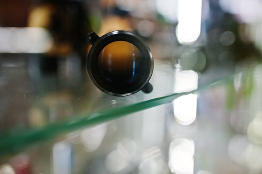 Optical sight on shelves store weapons on shop center. photo