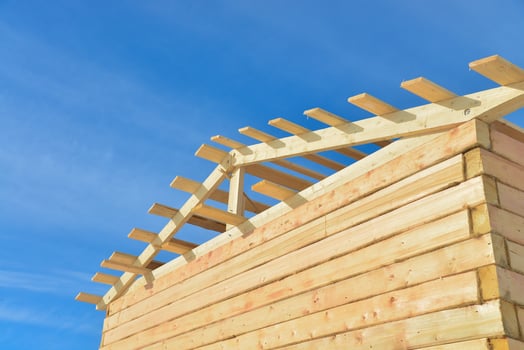 Details of construction wooden house on bule sky background, roofing timber structure system. photo