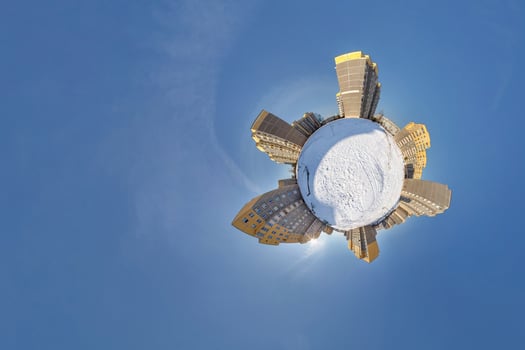 Little planet. Spherical aerial 360 panorama view high-rise building area urban development residential quarter butterfly in winter sunny day on blue background photo