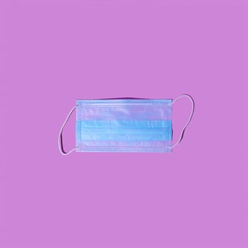 Doctor mask and corona virus protection isolated on pink background. photo