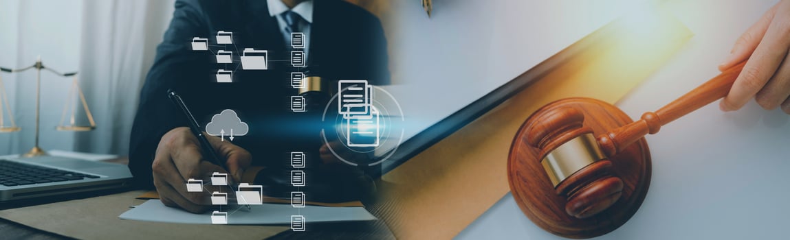 Justice and law concept.Male judge in a courtroom with the gavel, working with, computer and docking keyboard, eyeglasses, on table in morning light photo
