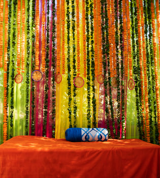 Traditional Indian outdoor wedding ceremony decoration. Decoration of colorful flower garlands, flowers, roses. Grooms pre-wedding outdoor ceremony decorations. photo