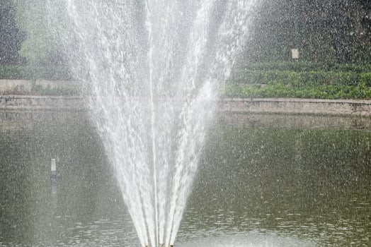 Fountain in the complex of Lodhi Garden in Delhi India, working fountain in the Lodhi Garden complex, water in the fountain, fountain in the Lodhi Garden park during morning time photo