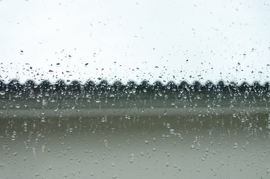 raindrops on the window of the house background photo