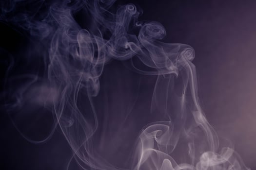 frankincense with white smoke on black background photo