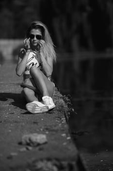 beautiful girl sitting on the pier photo