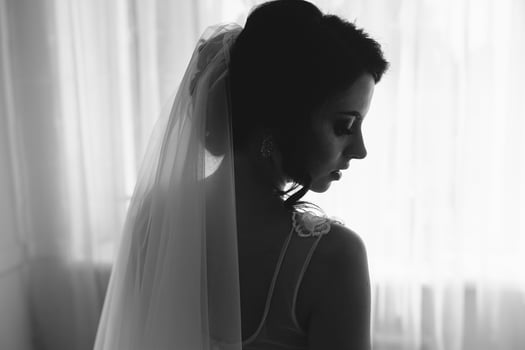 Bride posing in a large window photo