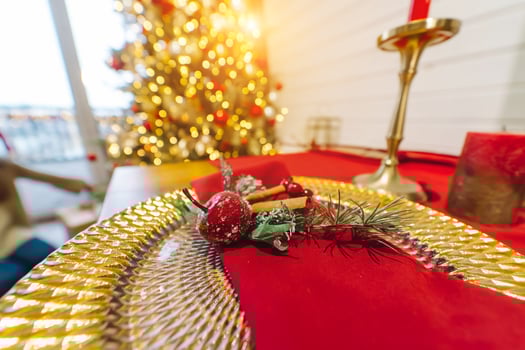 Decorative Christmas table, close-up. Christmas tree by the window. photo