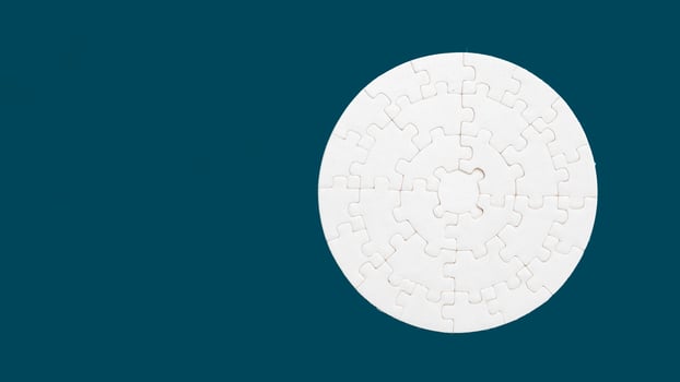 White part of jigsaw puzzle pieces on blue background. concepts of problem solving, business success, teamwork, Team playing jigsaw game incomplete, Texture photo with copy space for text