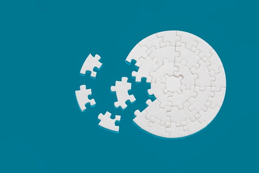 White part of jigsaw puzzle pieces on blue background. concepts of problem solving, business success, teamwork, Team playing jigsaw game incomplete, Texture photo with copy space for text
