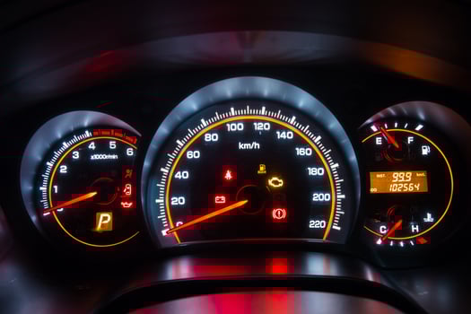 Modern car instrument dashboard panel in night time photo