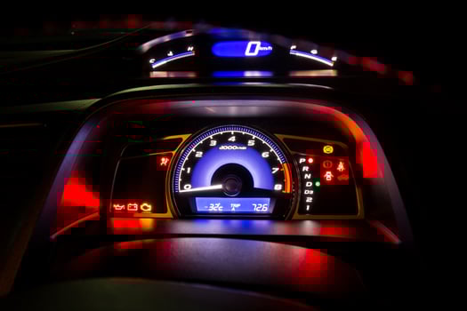 Modern car instrument dashboard panel and digital speed meter in night time photo