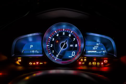 Modern car instrument dashboard panel or speedometer and full symbol in night time photo