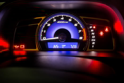 Modern car instrument dashboard panel in night time photo