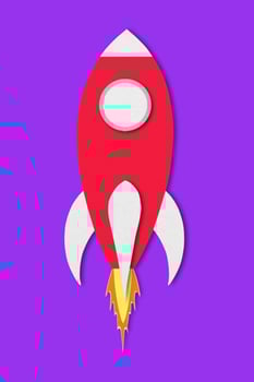 red spaceship paper isolated on purple background and clipping path design paper photo