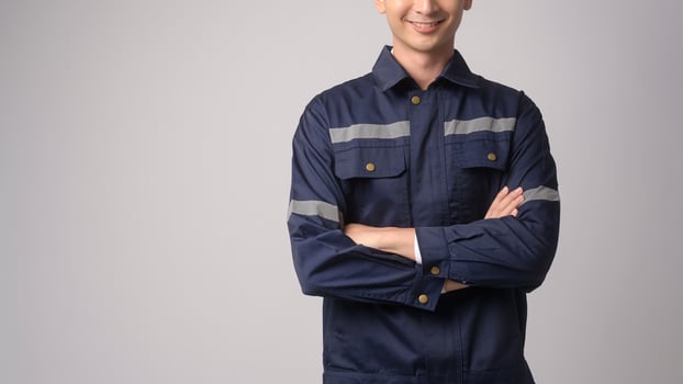 Portrait of male engineer wearing a protective helmet over white background studio. photo