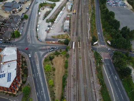 High Angle Footage of London Luton Town and Aerial view of Central Railway Station, Train Tracks of England UK photo