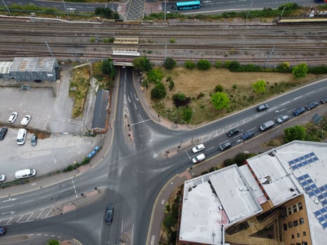 High Angle Footage of London Luton Town and Aerial view of Central Railway Station, Train Tracks of England UK photo