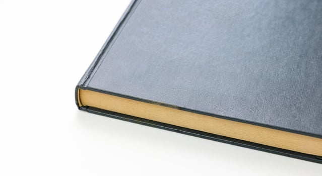 closeup blue book on white background photo