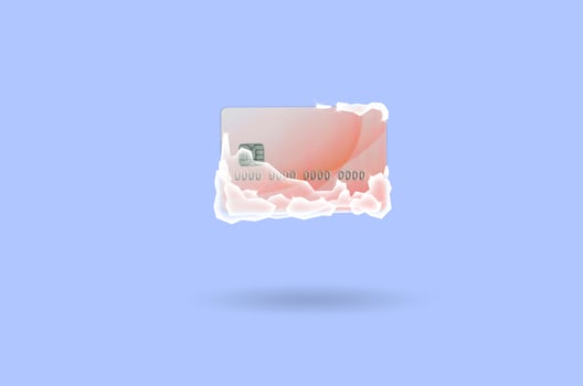 Frozen red credit card in white ice blocks photo