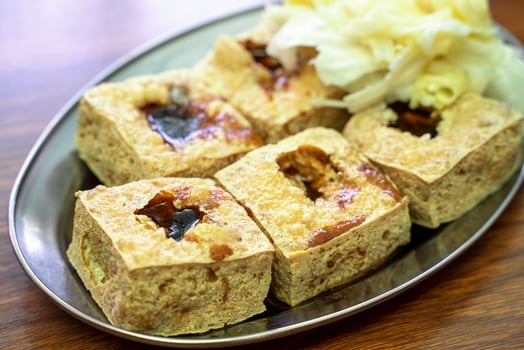 Deep fried stinky tofu with pickled cabbage, famous and delicious street food in Taiwan. photo