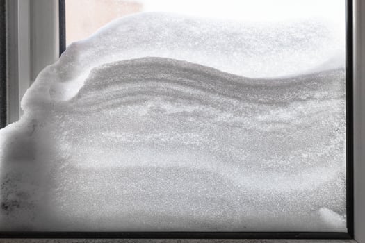 snowdrift between two windowpanes photo