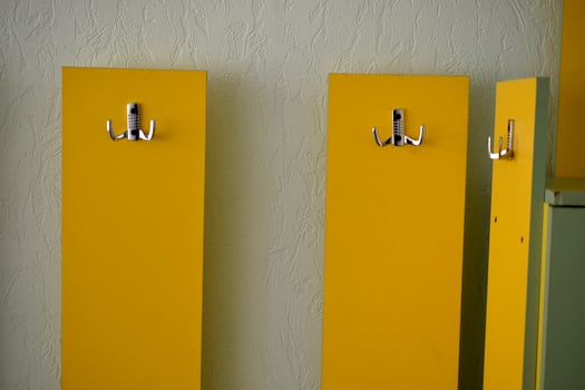 Yellow hanger indoors at home with silver handles photo