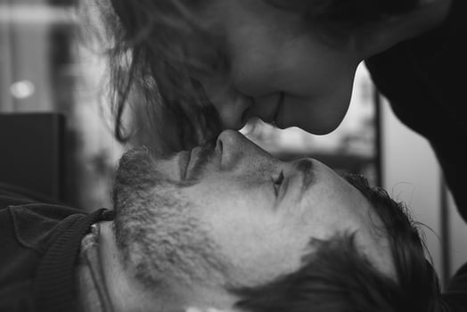 Vintage couple . Girl kiss her boyfriend from above  .Coffee shop photo