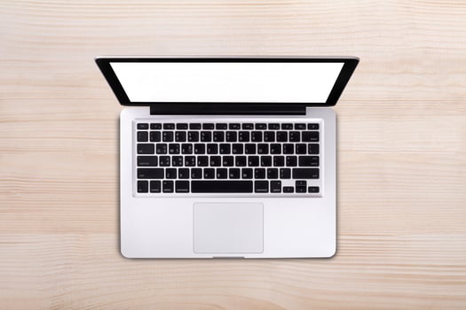 Top view laptop on wood table photo