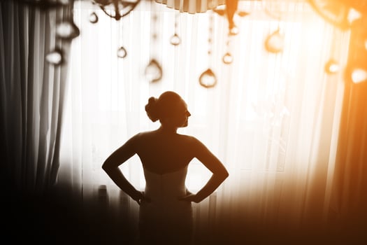 Beautiful bride posing in daylight photo