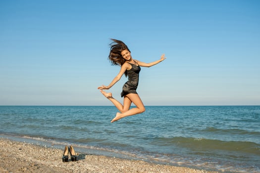 Young cheerful girl on the sea photo
